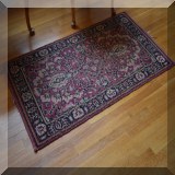 D66. Handknotted rug. Significant wear. 30” x 55” - $50 